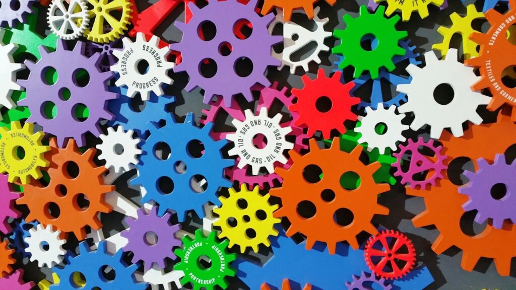 pexels-photo-171198 A colorful arrangement of gears symbolizing creativity, innovation, and machinery in vibrant colors.